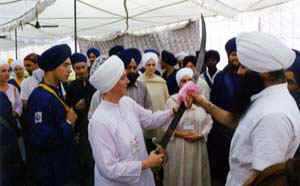 Hari Charan Kaur holding the sword and feeling the weight of it in hand