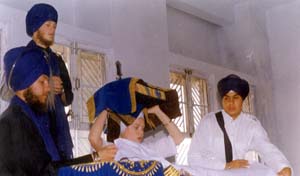 Sadh Bakshish Kaur doing Prakash in the Miri Piri Academy Gurdwara