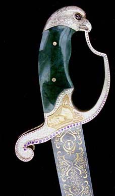 Sword decorated with white gold and diamonds, a portrait of the 10th Guru in yellow gold and a hawk embellished handle