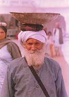 A Sikh carrying materials to repair the Parkharma